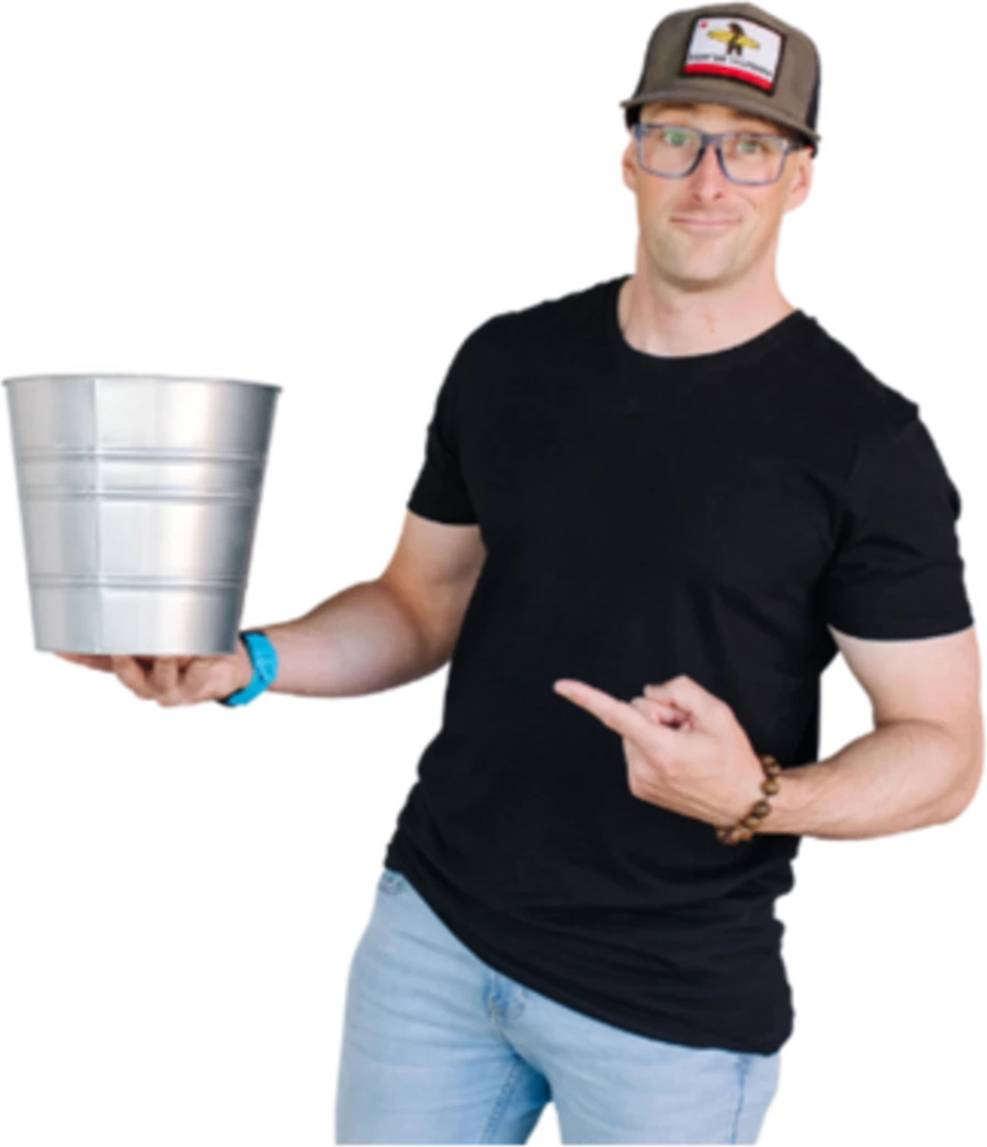 Steve holding a bucket, pointing at it.